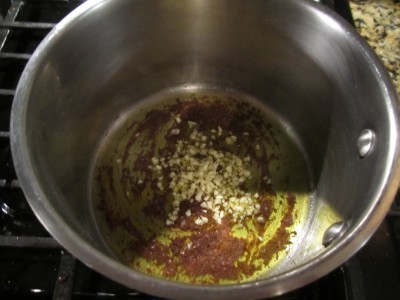 Garlic Cooking in Anchovies and Olive Oil