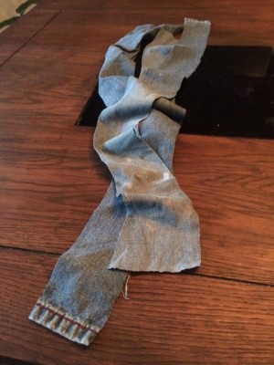 Three strips of old, crappy jeans.