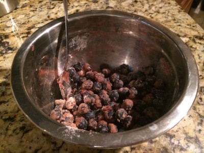 The mixture should cling to the berries like this.