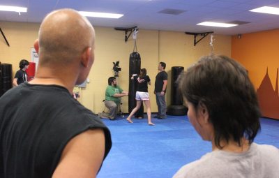 My Muay Thai teachers Arjun Dan King and Arjun Ying King watch shot setup - photo by Terrence Newber