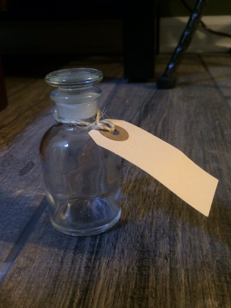 A glass bottle with glass stopper looks rather wizarding.